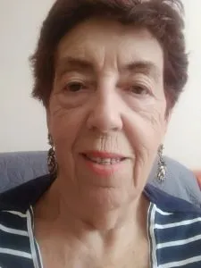 The same woman without a mask, her full face visible